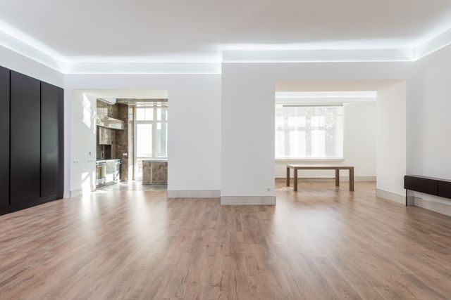 spacious empty room with wooden flooring